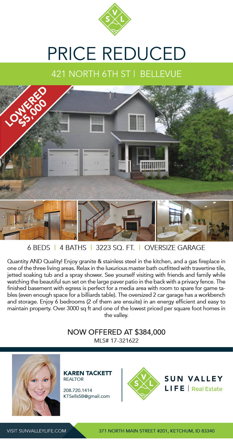reduced price flier showing grey house and front yard